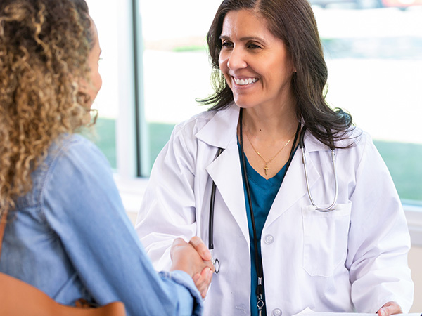 Smiling Doctor With Patient